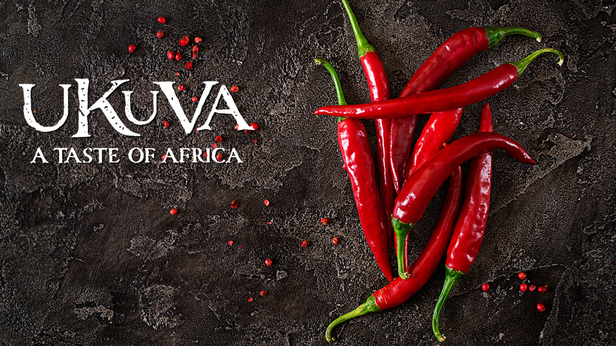 Red chillies on a slate surface